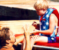 Pic of Didi in the Water Working With Chad as He Sits on the Dock