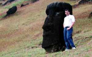 Roberto with one of the moai standing, half buried, on the inner slopes of Rano Raraku