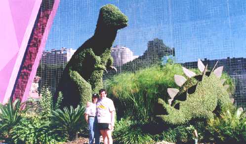 Topiary dinosaurs outside Epcot's Universe of Energy