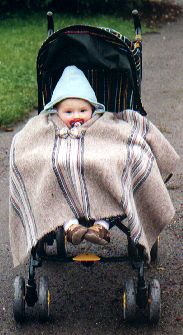 Tia on her first birthday, in the poncho Roberto and I bought her in Chile