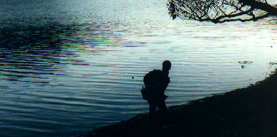 Carla skipping stones in the dusk, Kylemore Abbey