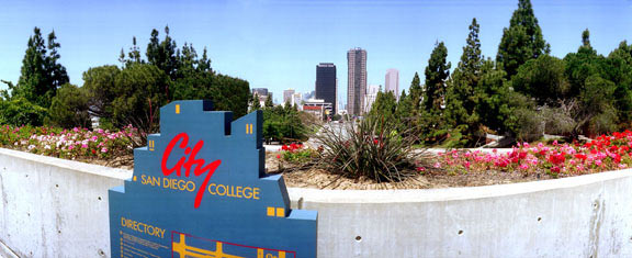 City College Sign with the city skyline behind the campus