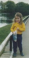 child feeding ducks