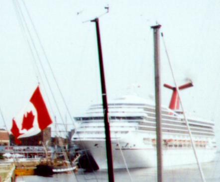 An Mid-19th Sailing Ship in Front of a Modern Cruise Ship