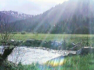 Mountain + Lake Scene With Rays of Sunlight Beaming Down