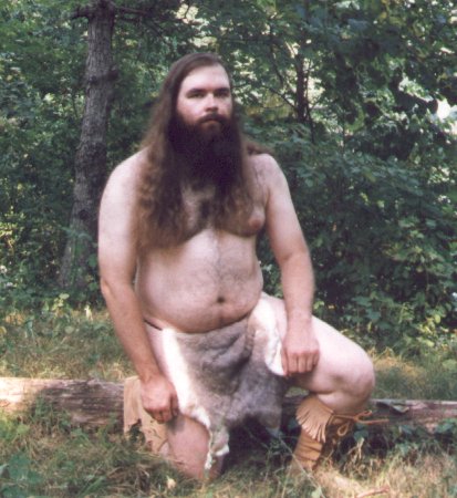 Rabbit skin loincloth, outdoors, kneeling