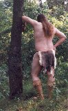 Rabbit skin loincloth, outdoors, standing rear view, thumbnail