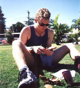 Malcolm opening a coconut in Kundra