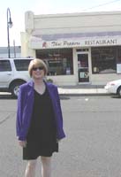 Kim in front of a Thai food restaurant