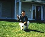 Aaron with Georgie (dog) in front of Aaron sister house at Kalamazoo - 1998