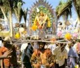 Indian devotees carrying the kavadi during Thaipusam