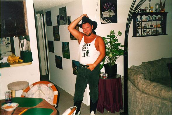 This is a picture of me in my living room, holding my cowboy hat