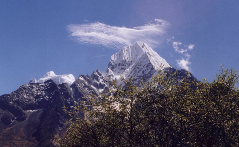 Wonderful cloud formation over the serrated ridges of Themserku