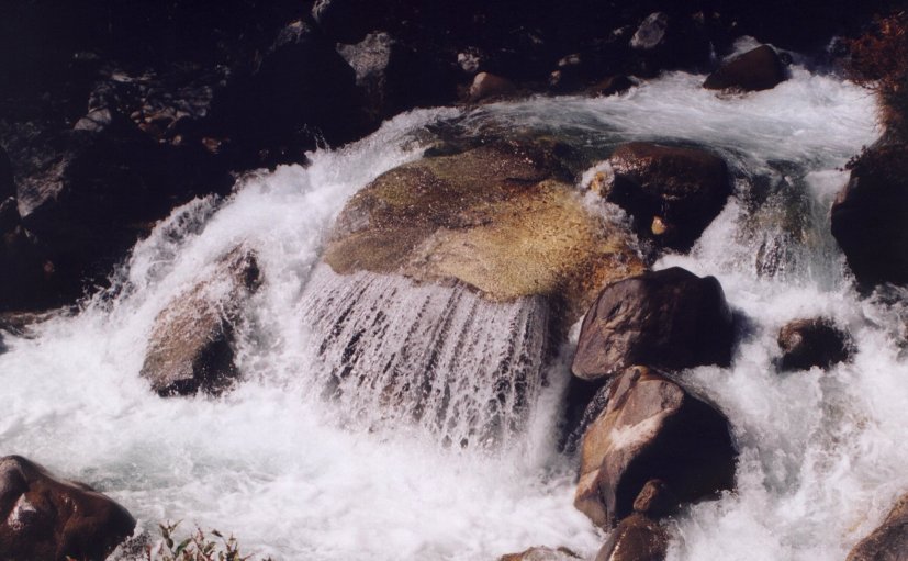 Water curtain over rock