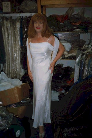 a lovely white dress with thin straps and a matching shawl