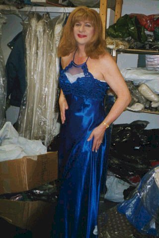 a shiny dark blue dress with a halter neck