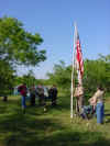 The troop at the flag pole with the flags up