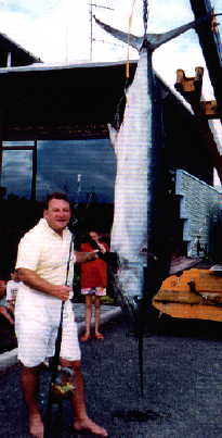 Bob standing next to his largest Marlin