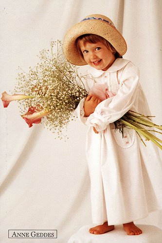 Little girl holding flowers