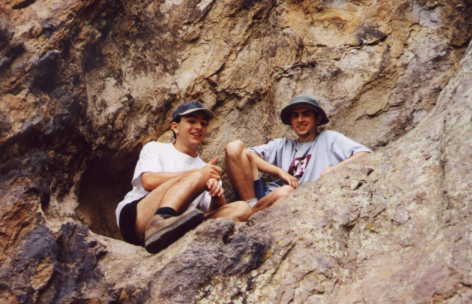 jeff and will in a rocky nook.  and yes, we had to climb to get to it