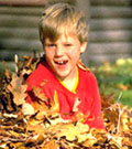 Playing in a Pile of Autumn Leaves to Add to the Soil